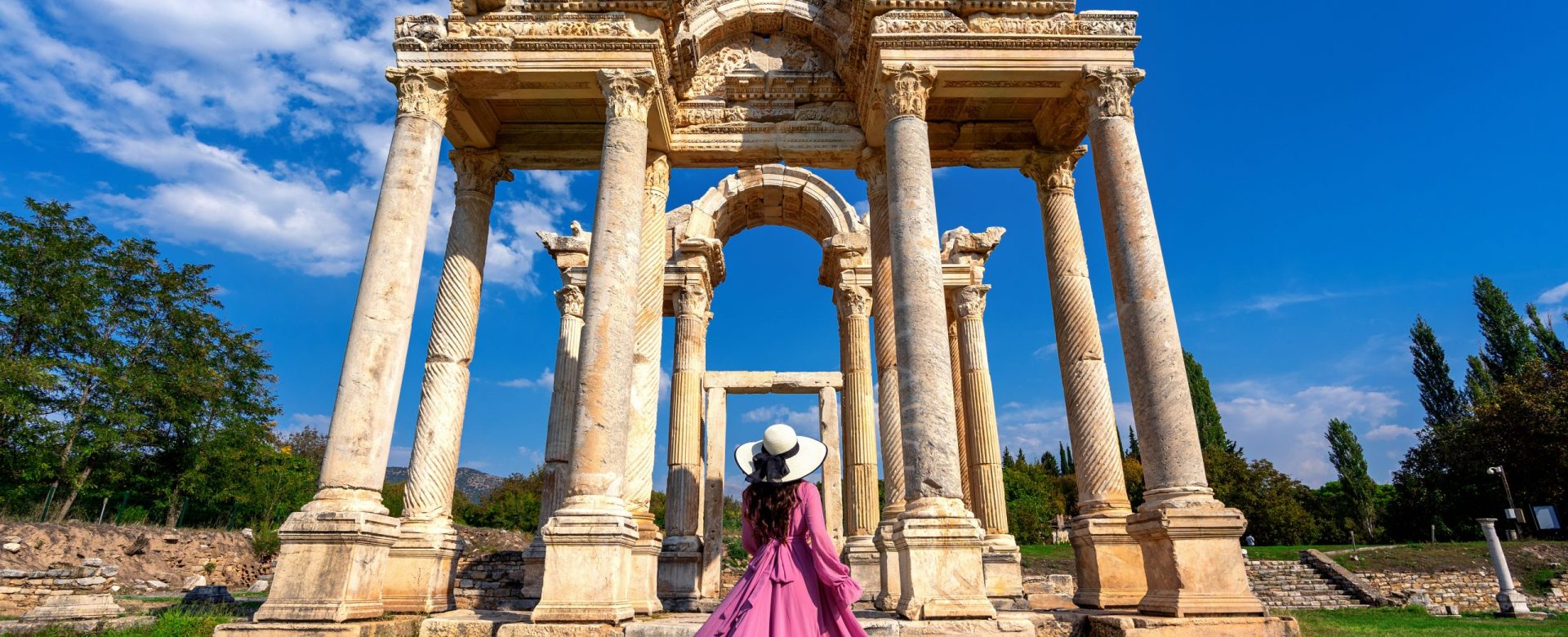 Beautiful girl walking at Aphrodisias ancient city in Turkey.