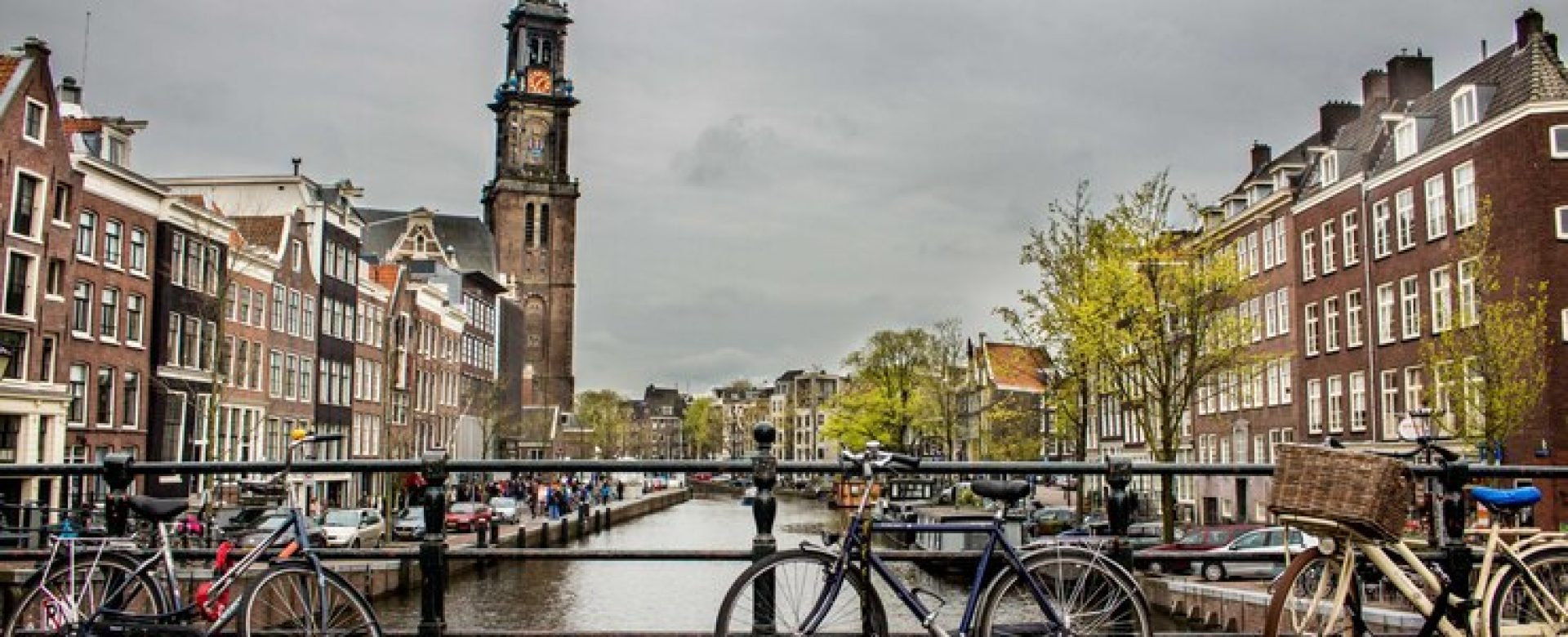 beautiful-shot-bicycles-leaned-again-fence-bridge-river_181624-3802