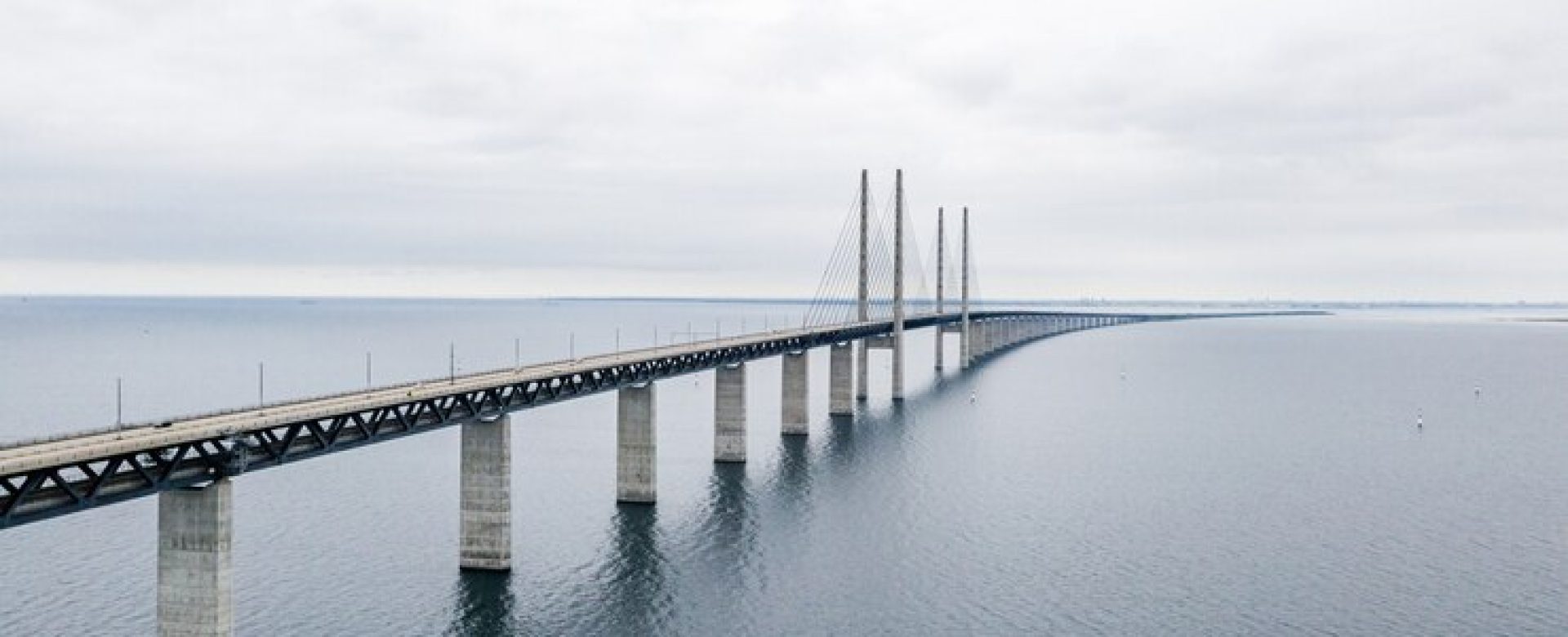 beautiful-shot-oresund-bridge-copenhagen-cloudy-sky_181624-41251