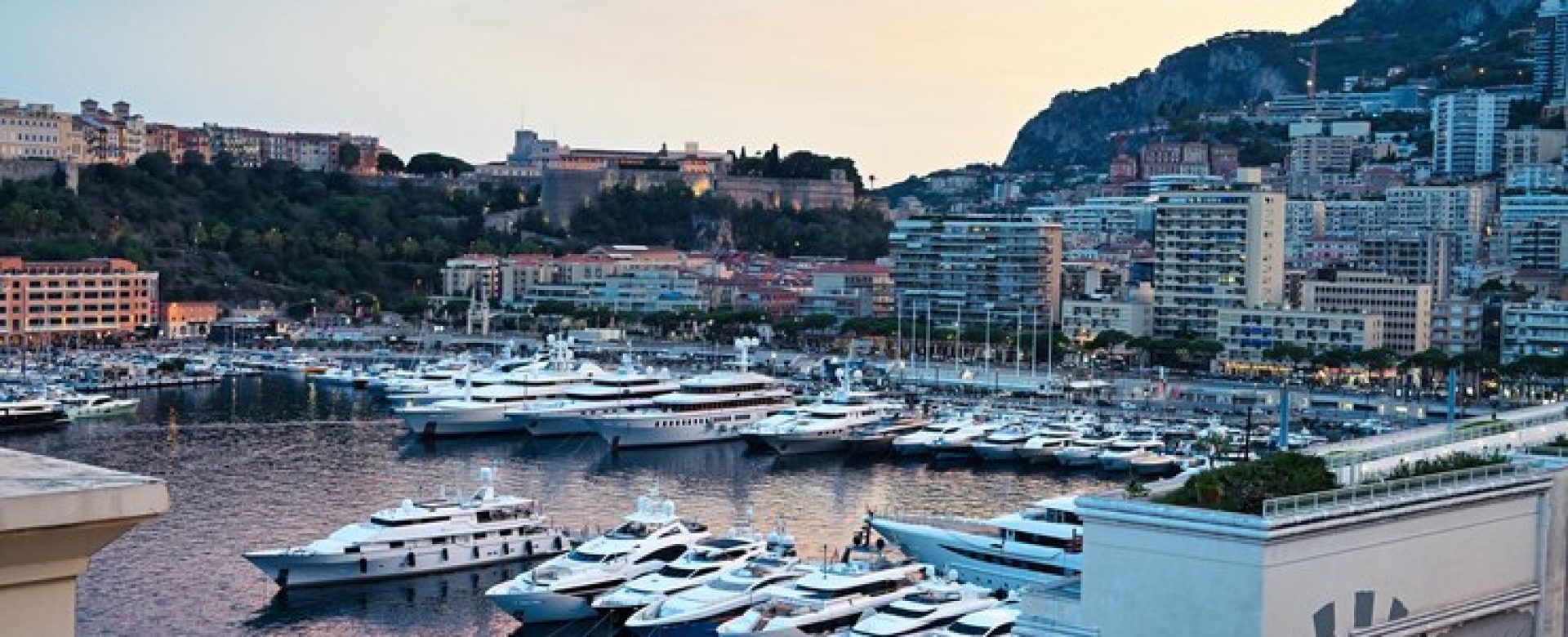 cityscape-monaco-sunset-sea-port-with-moored-yachts-residential-buildings-streets_1268-25668