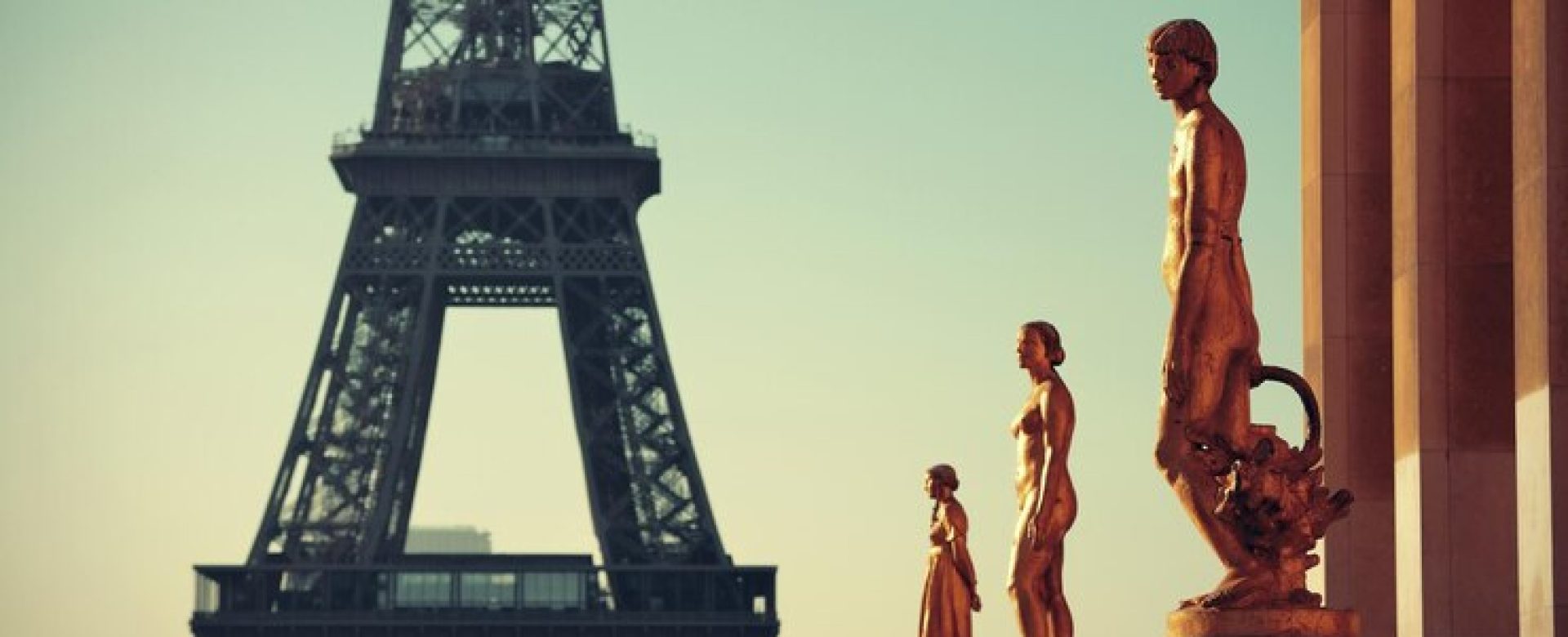 eiffel-tower-with-statue-as-famous-city-landmark-paris_649448-4867