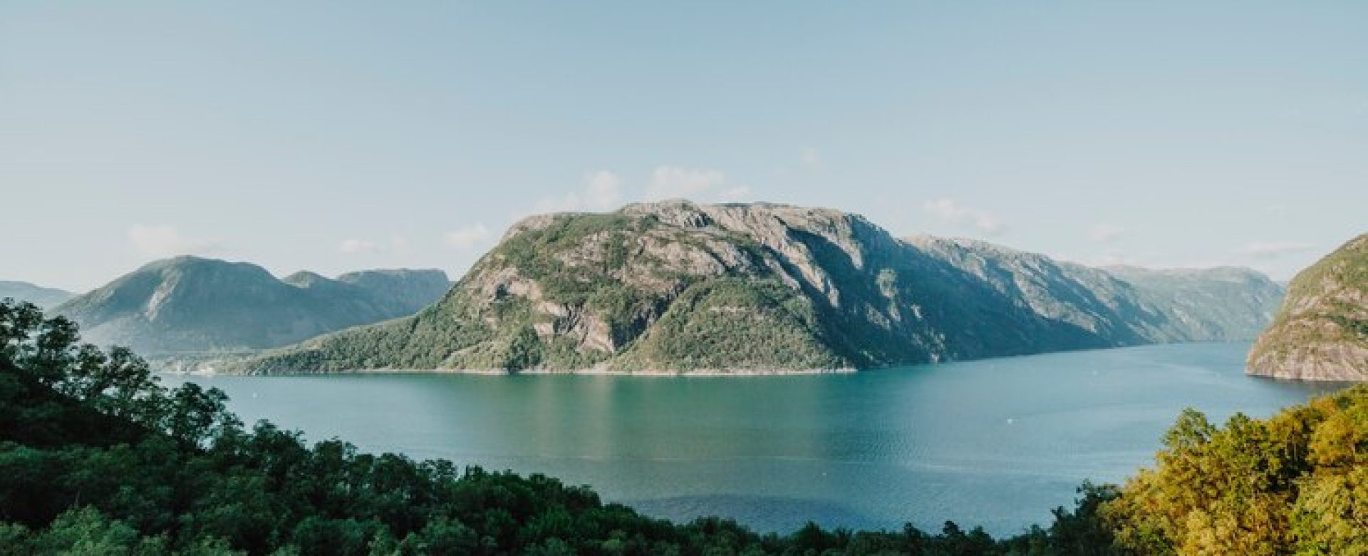 lake-surrounded-by-rocky-landscape_23-2148215251