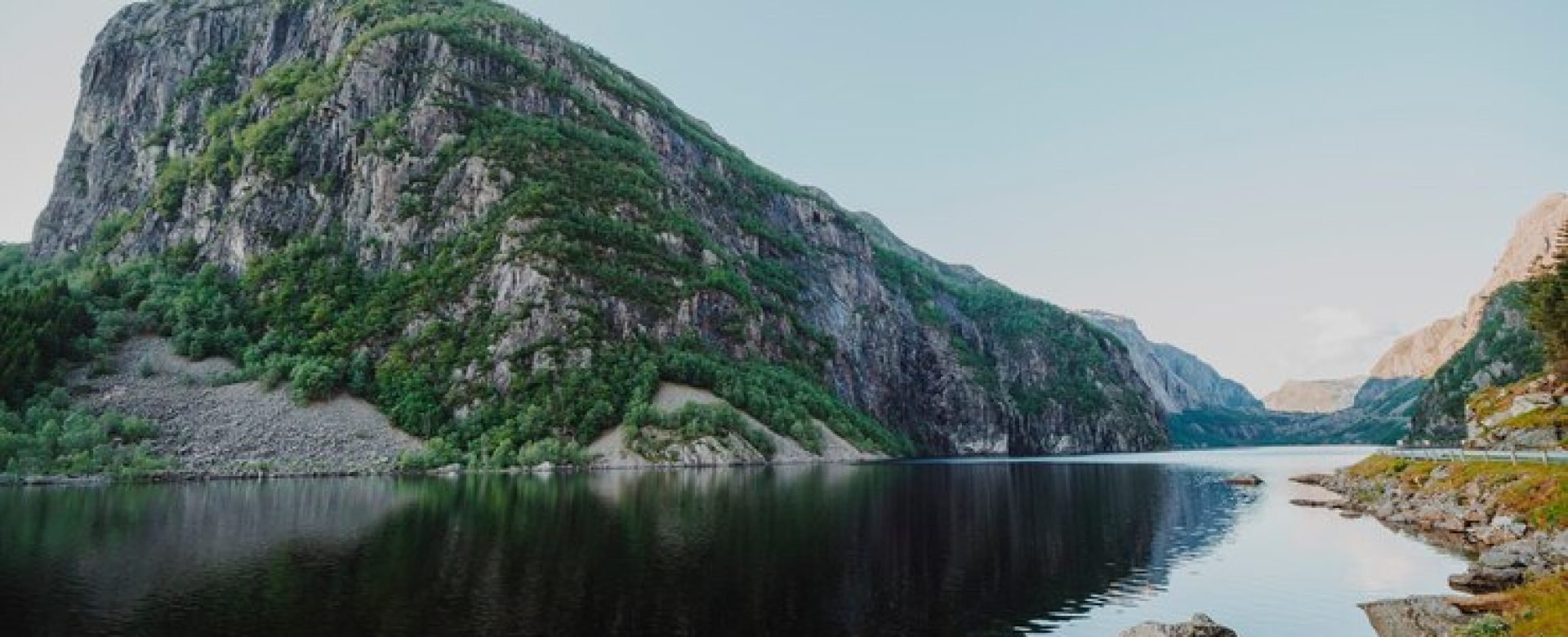 landscape-lake-surrounded-by-mountains_23-2148215263