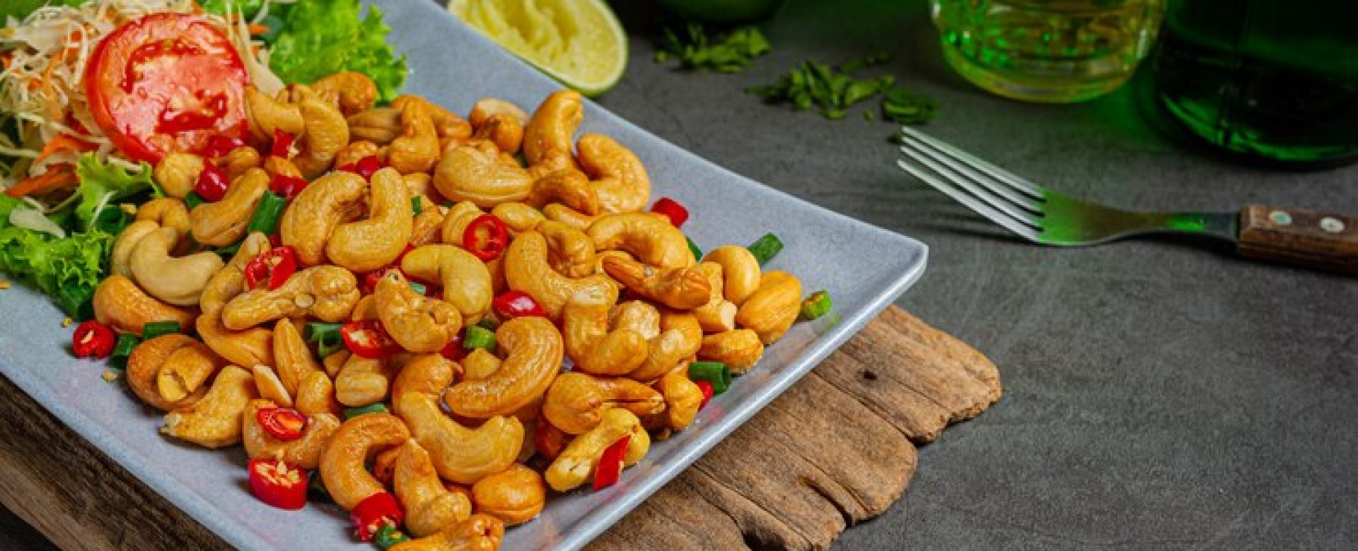 spicy-cashews-topped-with-chopped-hot-chilli_1150-24346