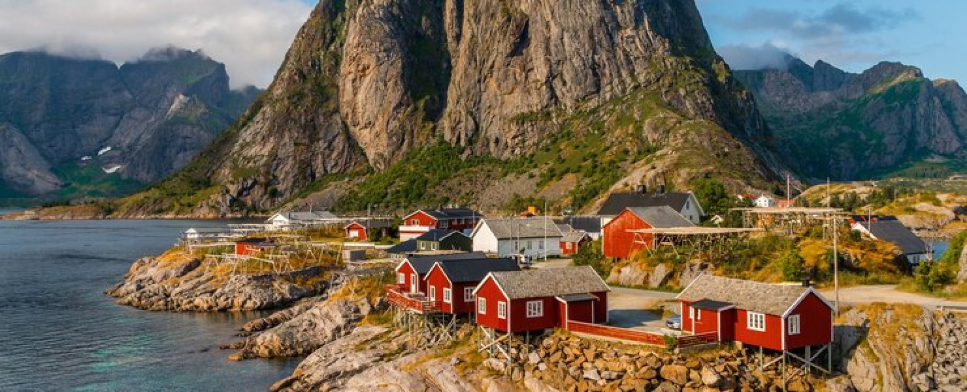 view-red-cottages-by-coastline-hamnoy-lofoten-islands-norway_181624-33160